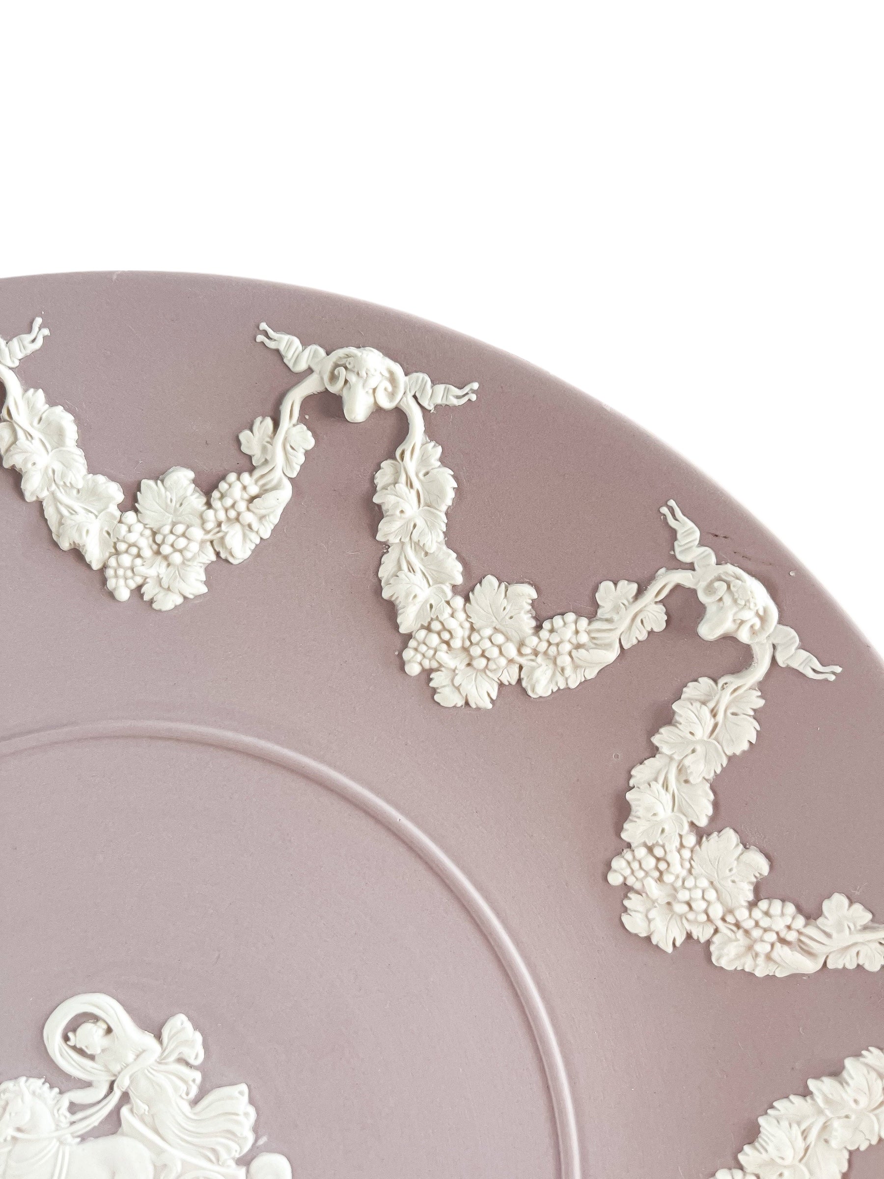 Lavender porcelain plate with intricate white grapevine and floral relief decorations