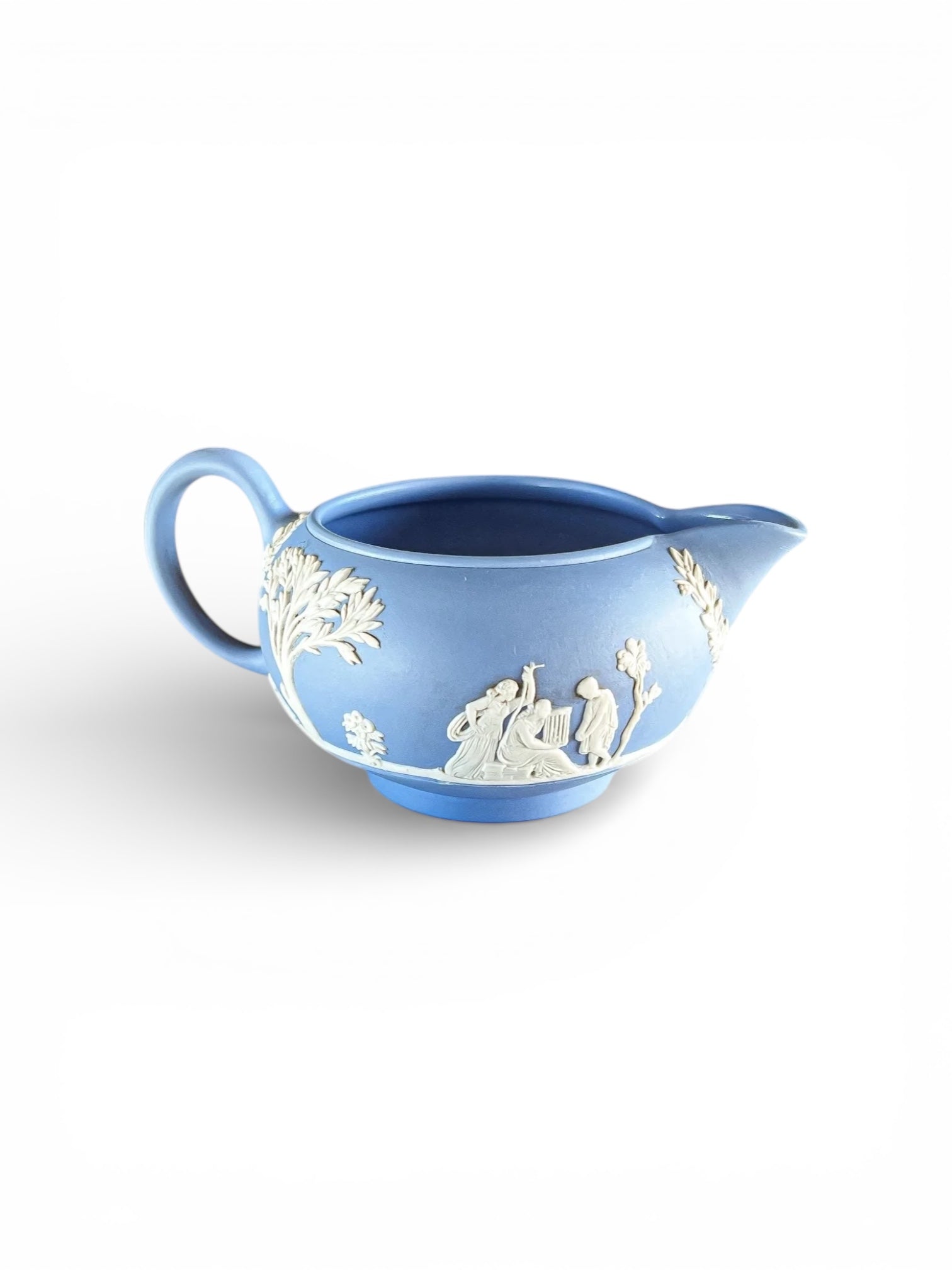 Blue Jasperware porcelain pitcher with white classical relief figures and floral details