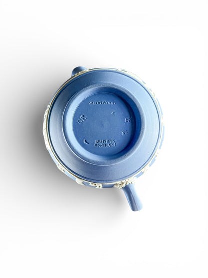 Top view of blue Wedgwood teapot with white floral relief, marked Made in England