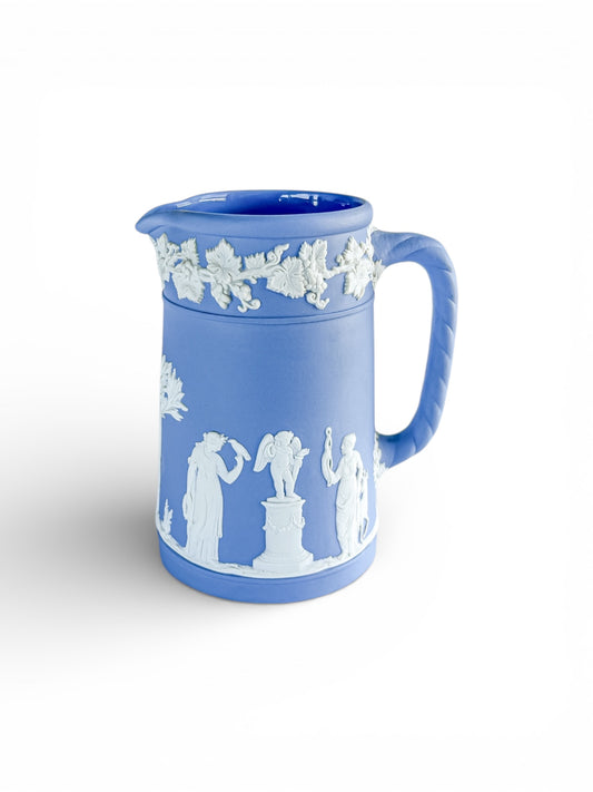 Blue Jasperware porcelain pitcher with white neoclassical relief figures and vine motifs