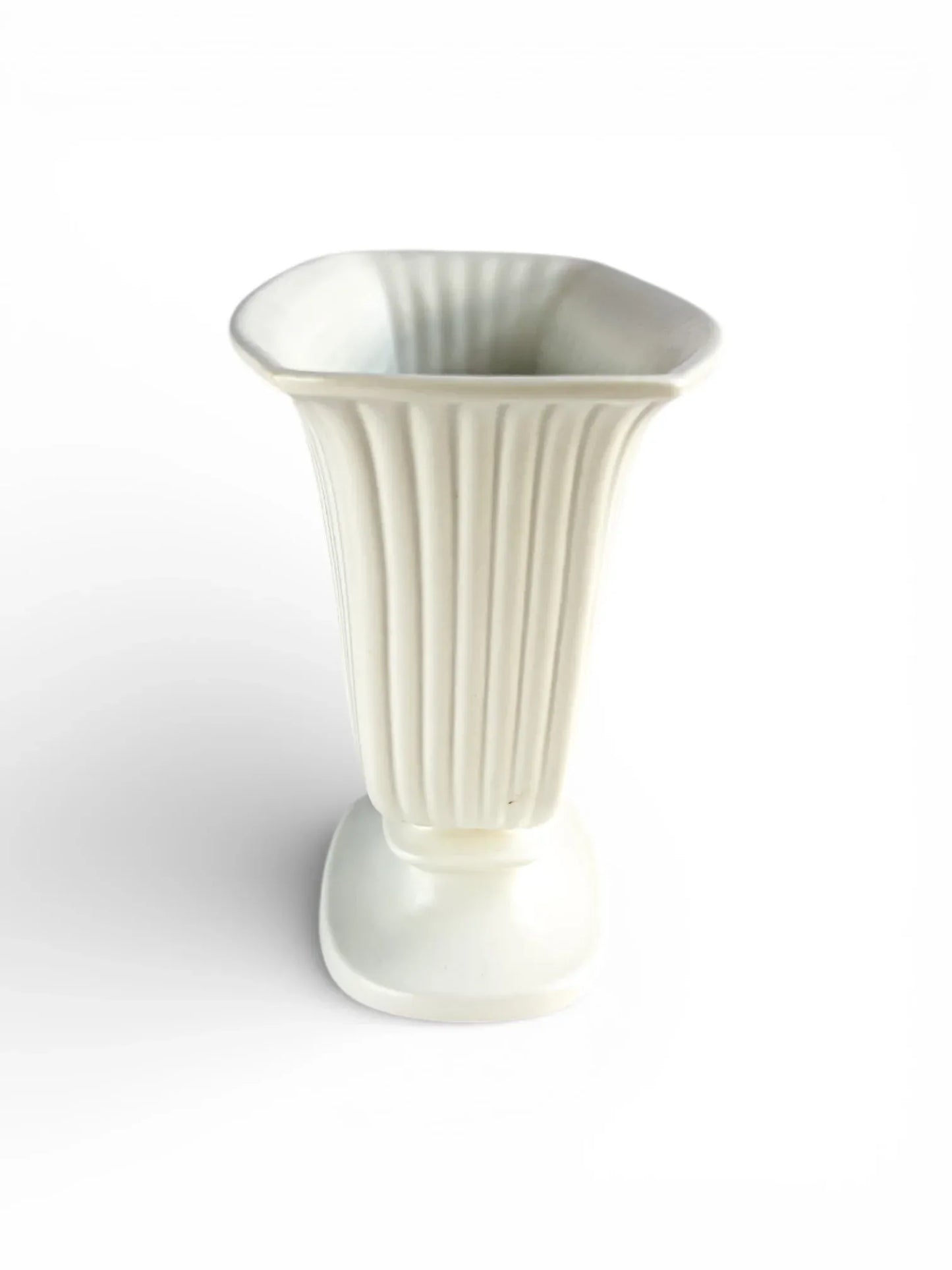 Vintage white ceramic vase with fluted design on white background, collectible home decor