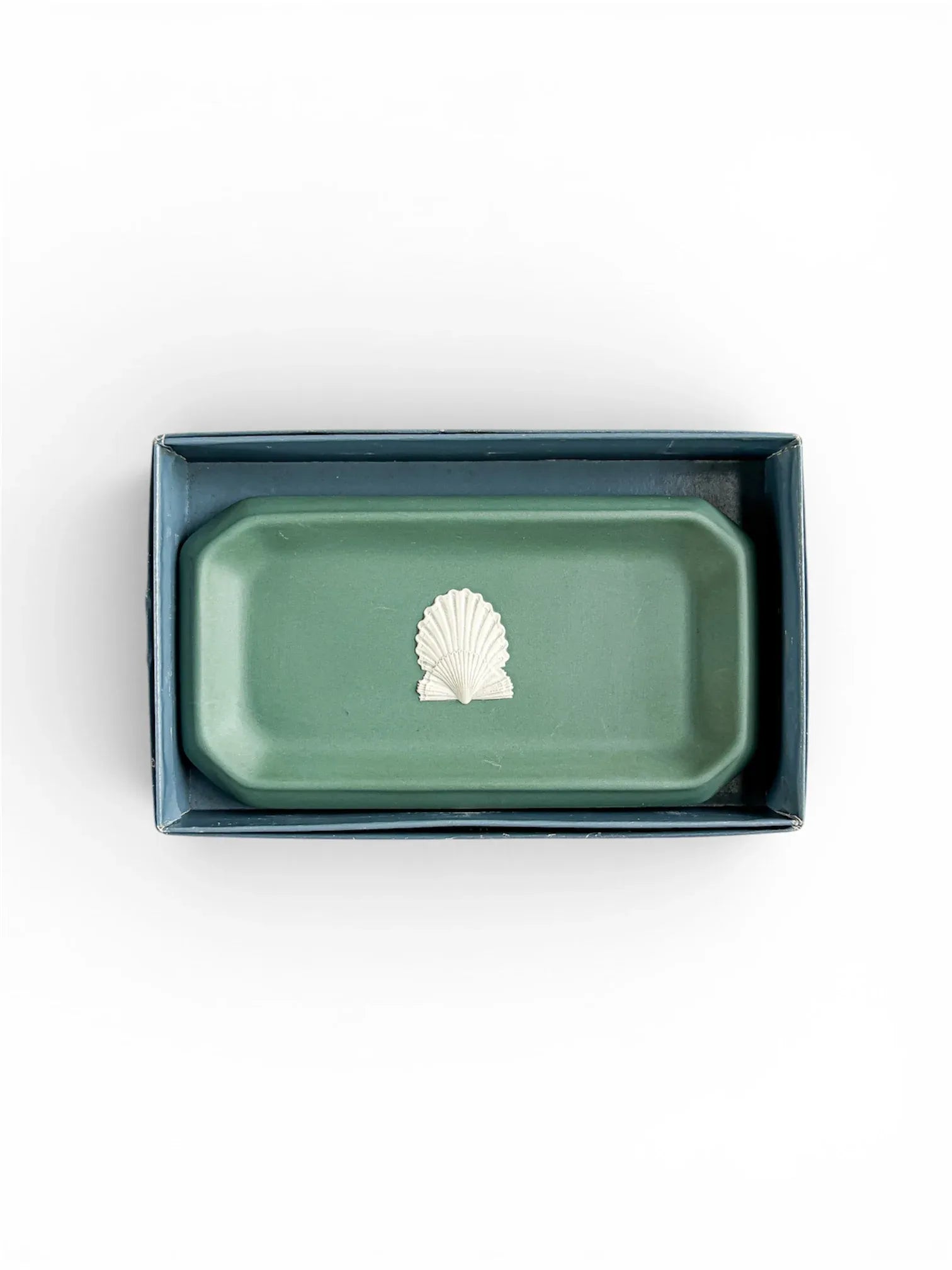 The Spruce Green Jasperware shell tray resting inside its original blue Wedgwood presentation box, viewed from above.
