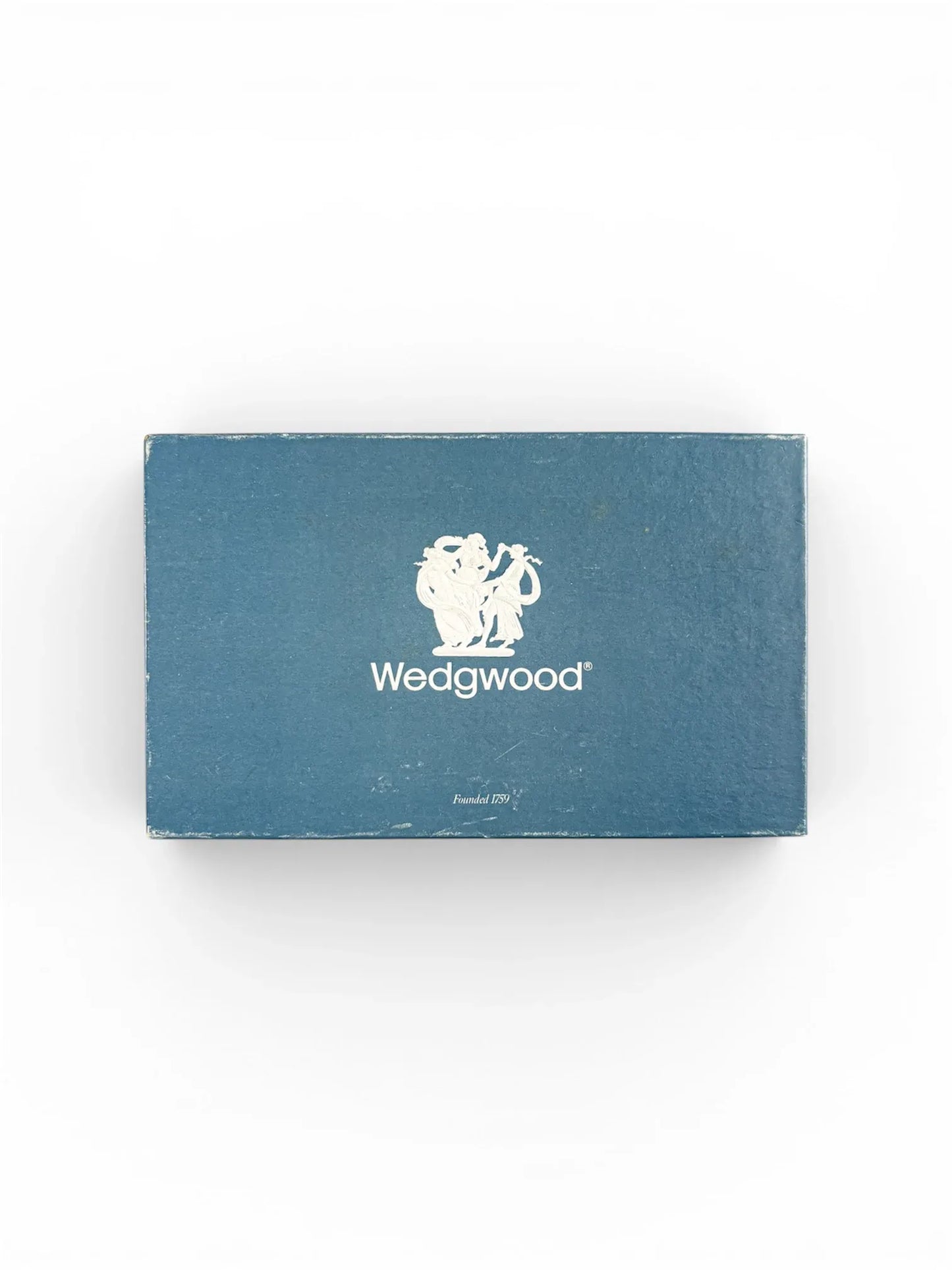The vintage blue rectangular Wedgwood presentation box with the brand's white logo and "Founded 1759" printed on the lid.