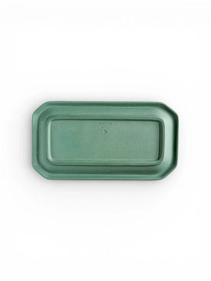 The underside of the octagonal Spruce Green tray, showing the recessed base and the authentic impressed maker's marks.