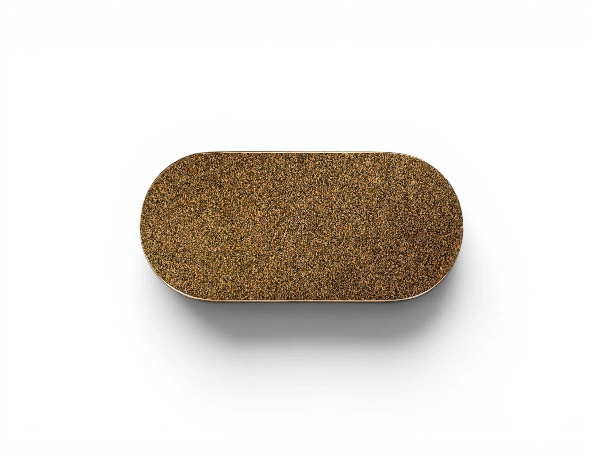 The underside of the Wiid Design ceramic brick, showing a perfectly fitted protective dark cork base. The cork provides a non-slip, soft surface to protect furniture while echoing the studio's signature material palette.