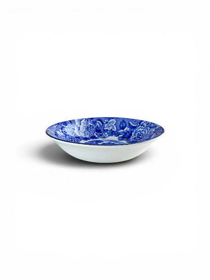 Profile view of a Wood & Sons 'English Scenery' blue and white bowl, showing its shallow, elegant form and clean white exterior.